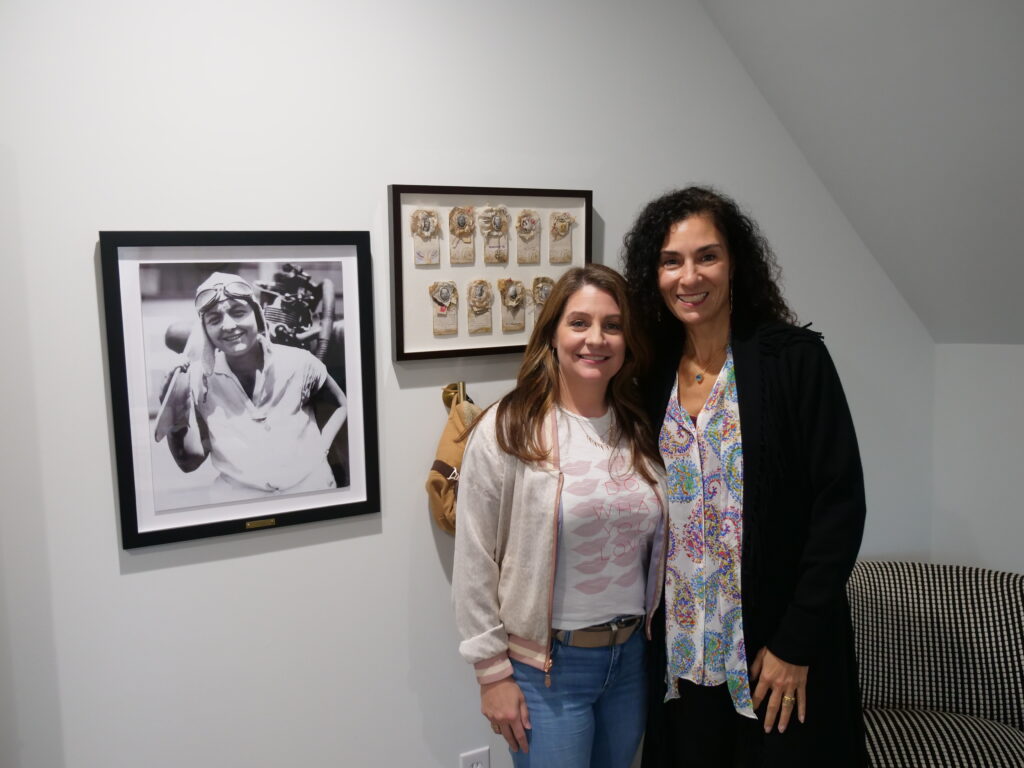 Sarah Burlew and Ginny Palmieri smiling in the Omlie podcast room